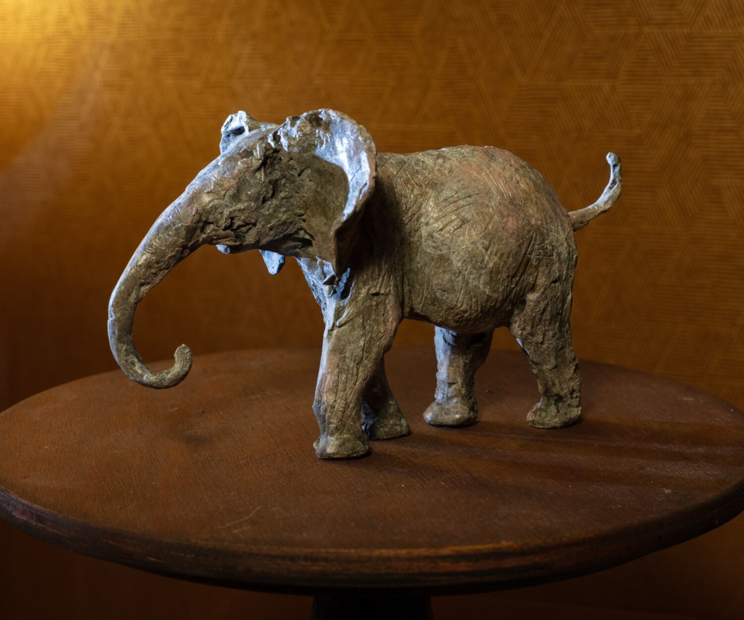 Bronze sculpture of an elephant titled "He's Not Heavy" by Heather Jansch